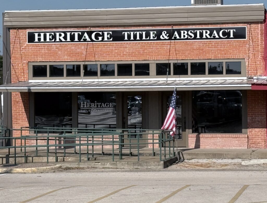 This is a photo of the building with a flag.