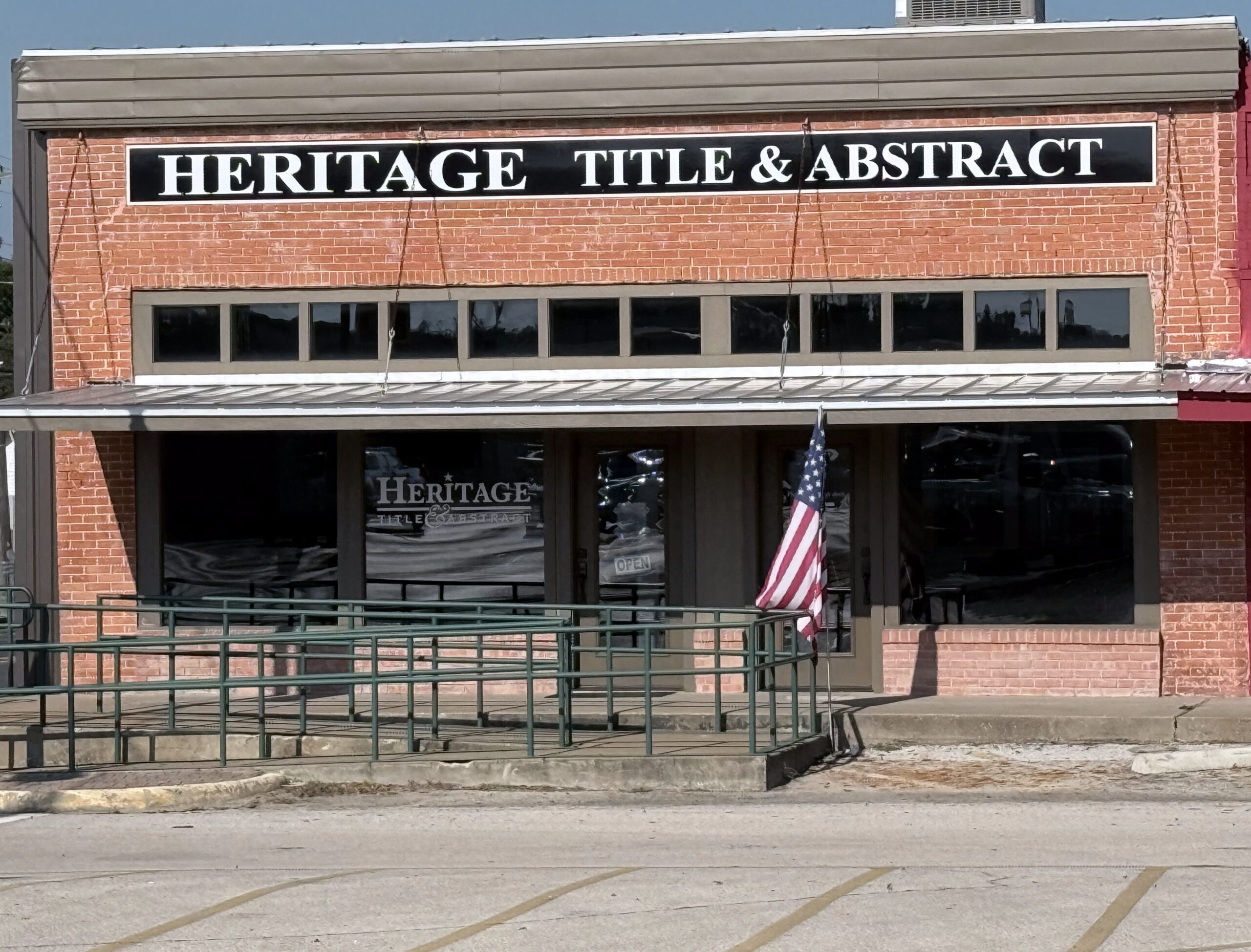 This is a photo of the building with a flag.
